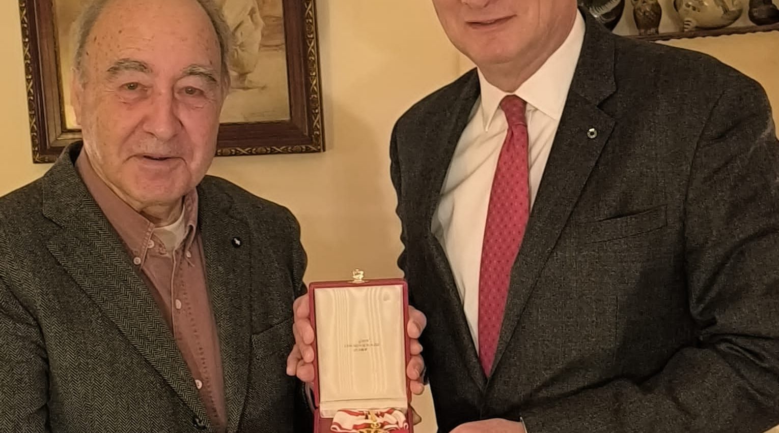 HE Ambassador Yves Gazzo, presents the honorary ensigns Pro Merito Melitensi